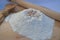 Flour heap with a fresh beer yeast for preparation of pizza dough.