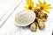 Flour of Jerusalem artichoke in bowl with vegetables on light