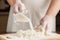 Flour pours from a glass plate in preparation for test