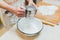 Flour sieved in hands women