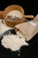 Flour sieved for homemade pastries. Accessories in home kitchen on a dark table