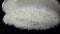 Flour sift flat sieve, black background. Slow motion, bottom view