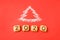 Flour Silhouette Christmas Tree with cookies digits 2020 on red background. Delicious bakery sweet confectionery Christmas card.