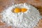 Flour and two egg yolks