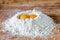 Flour and two egg yolks