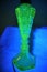 Flourescent glowing green uranium glass lamp base