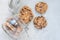 Flourless gluten free peanut butter, oatmeal and chocolate chips cookies in jar, top view, horizontal