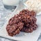 Flourless no bake peanut butter and oatmeal chocolate cookies  with glass of milk, square format