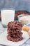 Flourless no bake peanut butter and oatmeal chocolate cookies, with glass of milk, vertical