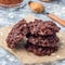 Flourless no bake peanut butter and oatmeal chocolate cookies on  parchment, square format