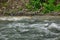 Flow Mountain River In Rocky Shores Landscape