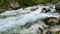 The flow of a mountain river in the stones