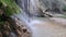 The flow of water from the waterfall is a beautiful sight