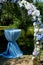 Flower arch for outdoor registration in nature with white and blue hydrangeas. With a table for Kolya, decorated with