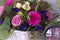 Flower arrangement in a basket decorate the wedding table in purple tones. Vintage.