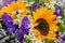 Flower arrangement, a bouquet with sunflowers and field daisies