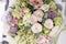 Flower arrangement. multicolor bouquet of beautiful flowers on wooden table. Floristry concept. Spring colors. Vertical