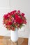 Flower arrangement of red roses in a nice living room