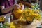 flower arranging with pollen-covered vase in the background