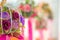 Flower artificial mobile hanging on blurred and bokeh reflection lighting of lights decorating. New years and Party Concept.