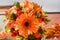 Flower autumn colors with red berries of viburnum,orange gerbera,berries of eucalyptus,orange Ornithogalum,orange bouquet roses of