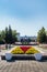 Flower bed and Cosmos fountain on Veterans Square. Altai Krai Administration building in the long plan