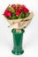 Flower bouquet arrangement in green vase lateral view