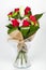 Flower bouquet arrangement and lily in transparent vase lateral view