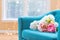 Flower bouquets in luxury home with turquoise chair
