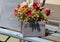 Flower box with colorful pansies on wood bench