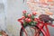 Flower close up on saddle red bicycle classic vintage