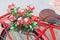 Flower close up on saddle red bicycle classic vintage