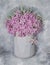 Flower composition, watercolor, painted floral bouquet in soft, pastel colors with close-up pink flowers in a vase on vintage back