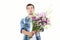 Flower delivery. Guy with bouquet of flowers isolated on white. Mock up and copy space. Happy birthday. Valentine and mother day