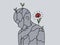 Flower growing on stone person