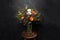 Flower Ikibana on a black background, bouquet in a glass vase