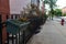 Flower Planter on a Home Fence along an Empty Residential Sidewalk in Jersey City New Jersey