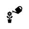 Flower in a pod with watering can simple black icon. Growth concept vector icon.