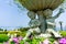 Flower pot decorated with childern plaing music sculptures in Botanical garden on Oedo Botania island