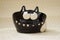 Flower pots in the form of a cat. crazy cat with bulging eyes smiles at the world. Handmade. Decor engobe, covered with