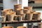 Flower pots of red clay, container for growing flowers. Many group of clay pots, flower shop window, a market stall, products for