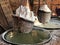 Flower Salt extraction methods. Sin-Thao Salt in basket over heating water from pond.