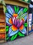 Flower street art graffiti near a market in London