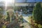 Flowerbeds with some wrapped plants in a snowy winter garden. Berlin, Germany