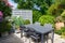 Flowered terrace with garden furniture