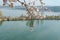 Flowering branches of apricot tree under river landscape