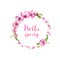Flowering cherry tree, apple blossom, spring petals of pink flowers. Floral wreath, note Hello spring . Watercolor round