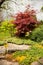 Flowering rock garden in spring. Different bushes and flowers bl