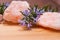 Flowering rosemary placed between large pink salt stones