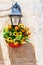 Flowerpot bouquet flowers, lantern lamppost. Wall.